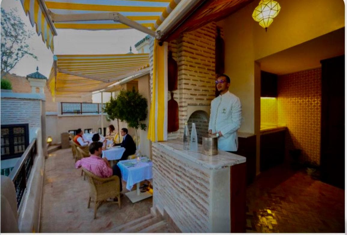 Rooftop dinner service at twilight