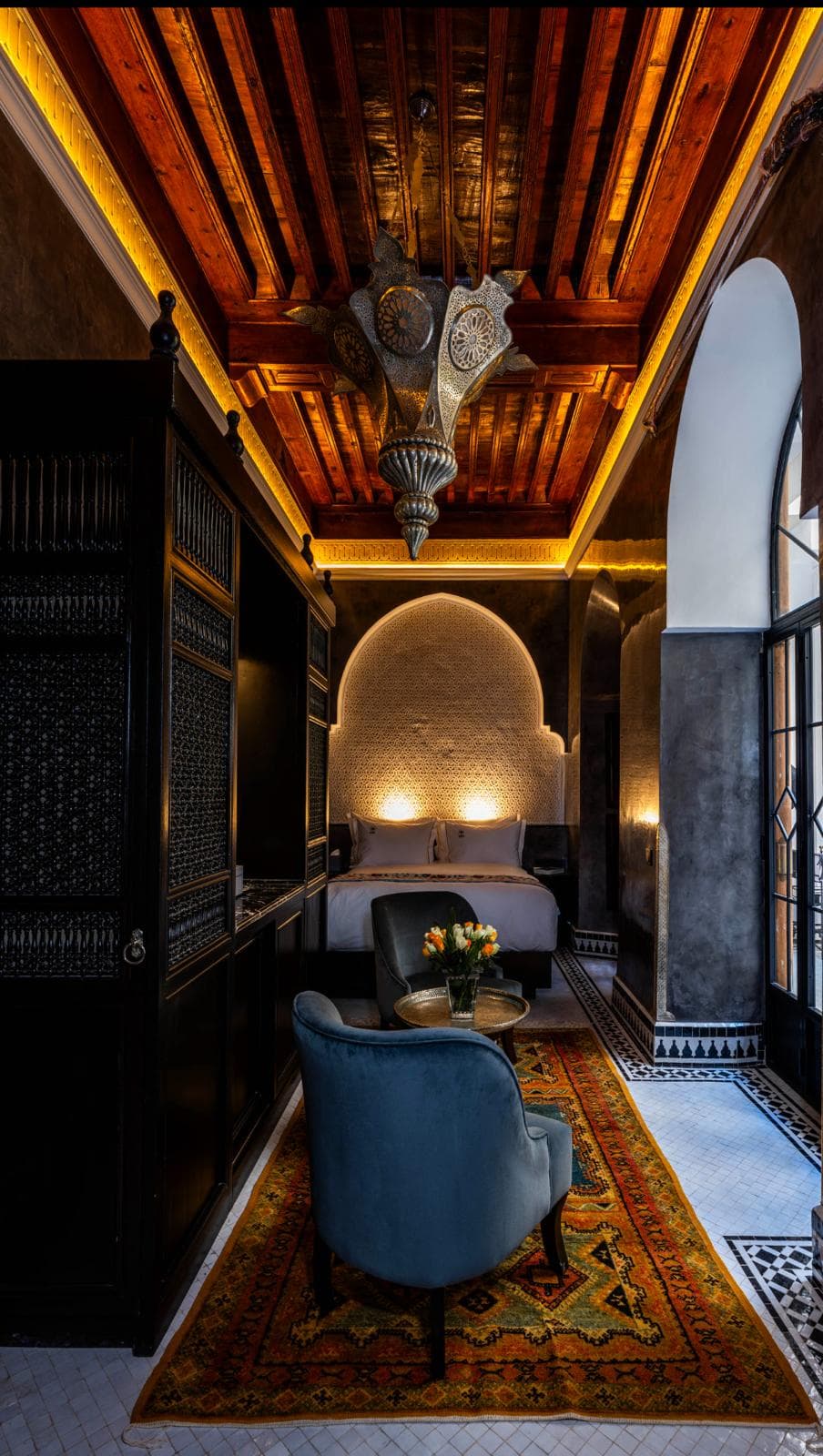 Luxurious suite interior with traditional Moroccan craftsmanship at Riad Sa'eed